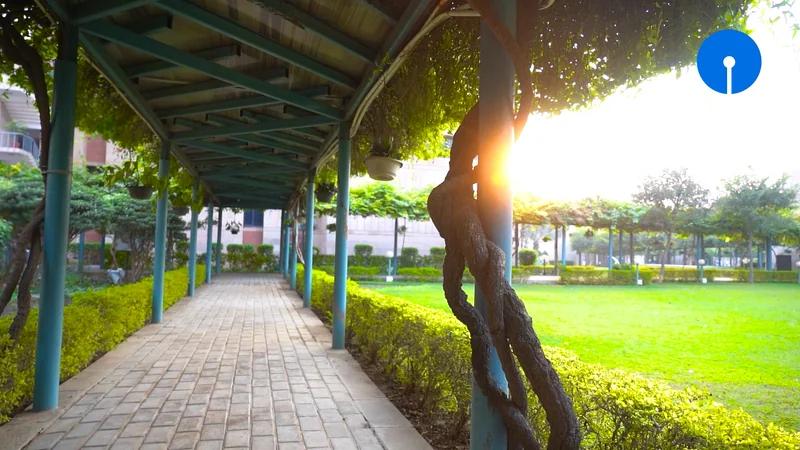 Golden-hour walkway across the State Bank Academy campus