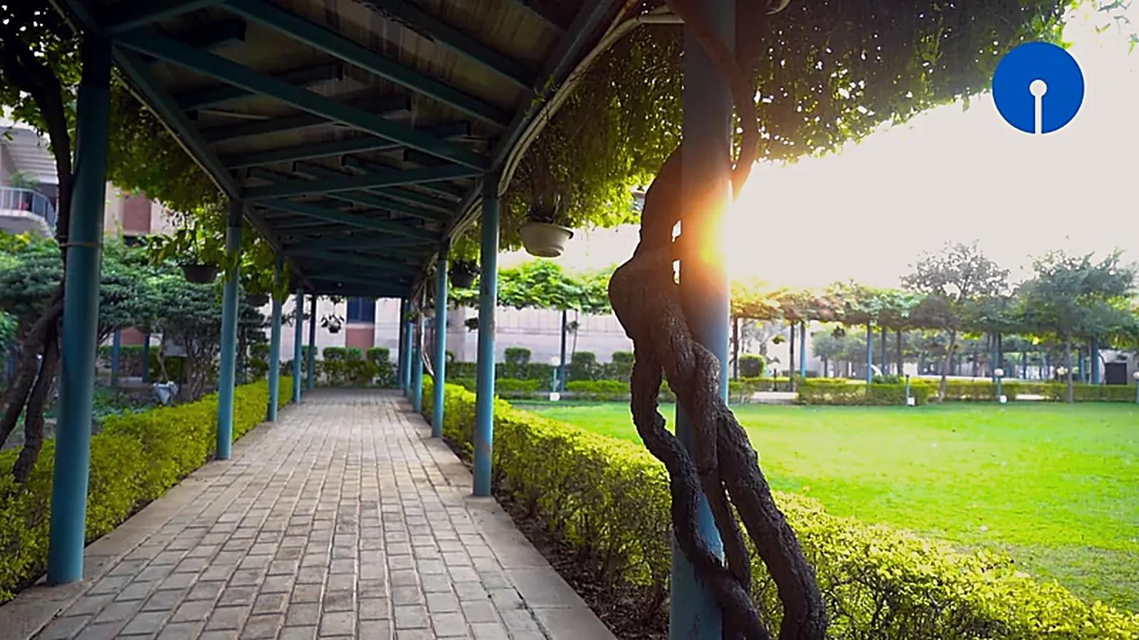 Golden-hour walkway across the State Bank Academy campus